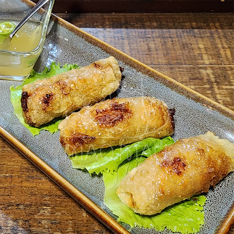 Cha Giò - Vietnamese fried spring rolls with ground pork, carrots & mung bean noodles served with lettuce, fresh herbs & the traditional nůóc châm sauce