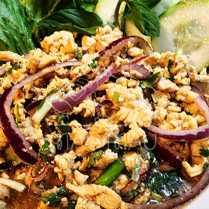 Laab**+ - served warm with red onions, mint, lime & chilies - with minced chicken or fried fish